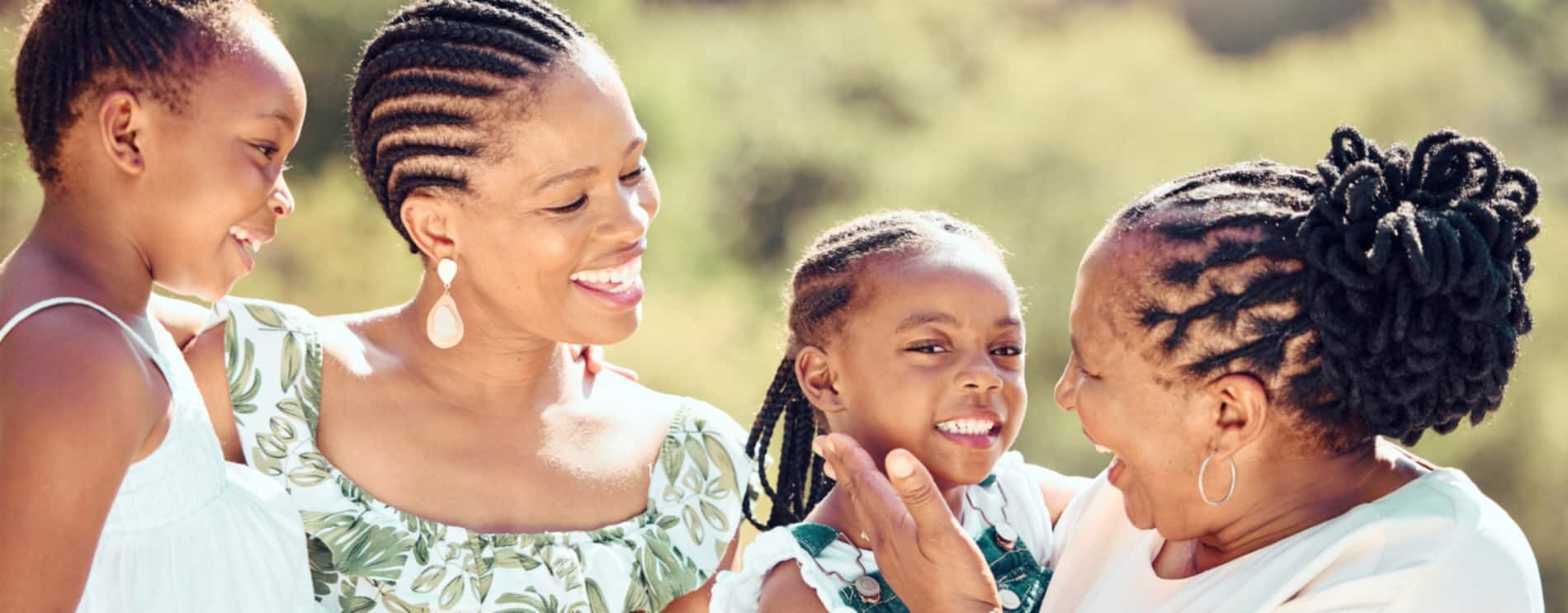 Grandmother, daughter, and two grandchildren outside.