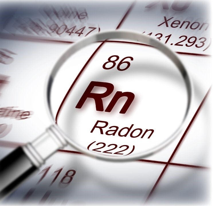 A magnifying glass showing Radon.