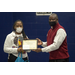 Rock Hill Housing Authority's Executive Director presenting Kenyell Worthy a Certificate of participation for presenting her business idea K.C.L Hair & Nails.