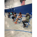 woman lined up next to each other sitting in chairs