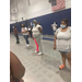 Women standing in front of an american flag