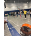 women lined up playing games in a gym