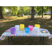 a table full of buckets for children to collect eggs in