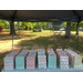 multiple rows of gift bags sitting on a table