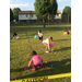 5 children hunting for easter eggs in a park