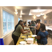 A line of women being served Italian food