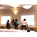 A group of three women being served food