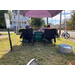 Two volunteers sit across the table from two residents that have come to be assessed.