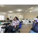 Older lady sitting in a wheelchair waiting.