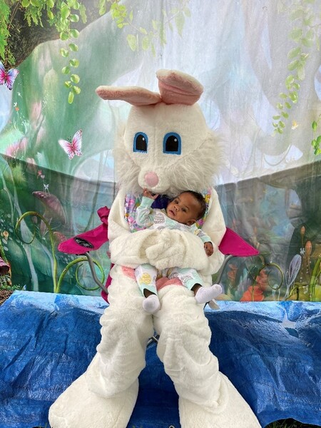 Easter bunny holding a baby.