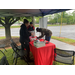 Person signing in under a tent for the job fair.