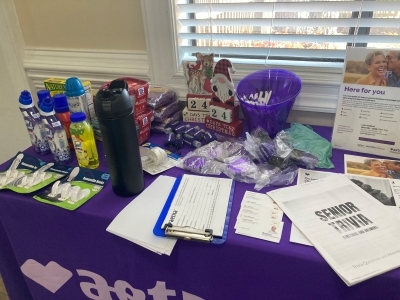 Atablefullofinformationandpossibleprizesforthe2025FallFestival..jpg A table full of information and possible prizes for the 2025 Fall Festival.