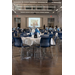  Tables and chairs in a ballroom set with balloons and decorations.  