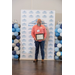  A man with a beard holding a framed certificate.  