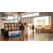  Three people looking at photos and prints.  