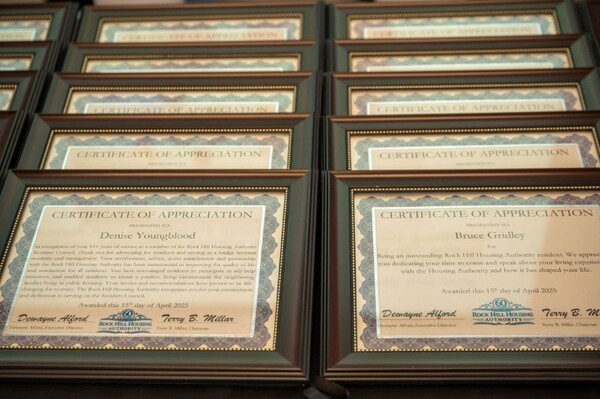 Rows of framed certificates. 