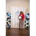  Woman Smiling and holding a framed certificate. 