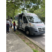  People stand outside Bucks Ice cream truck.  
