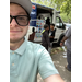  A man taking a selfie outside Bucks Ice cream truck. 