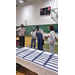  Four people stand and talk. 